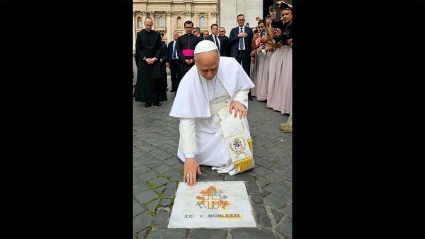 Pope Leo XIV prays at the spot where St. John Paul II was shot